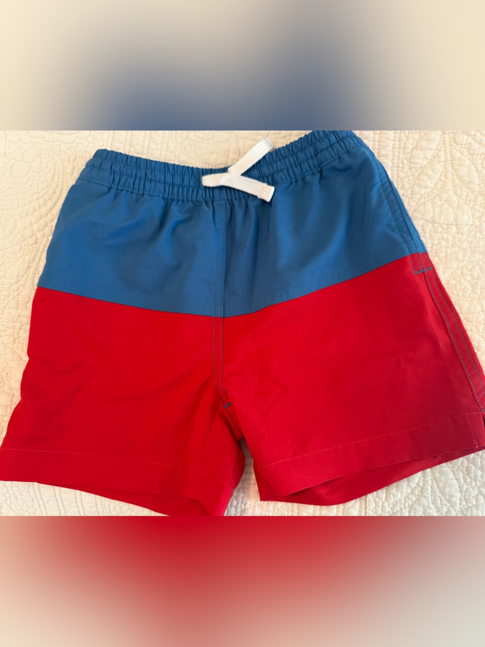 Chubbies swim trunks.  Boys 4T.  Red and blue color block with stars (in water)